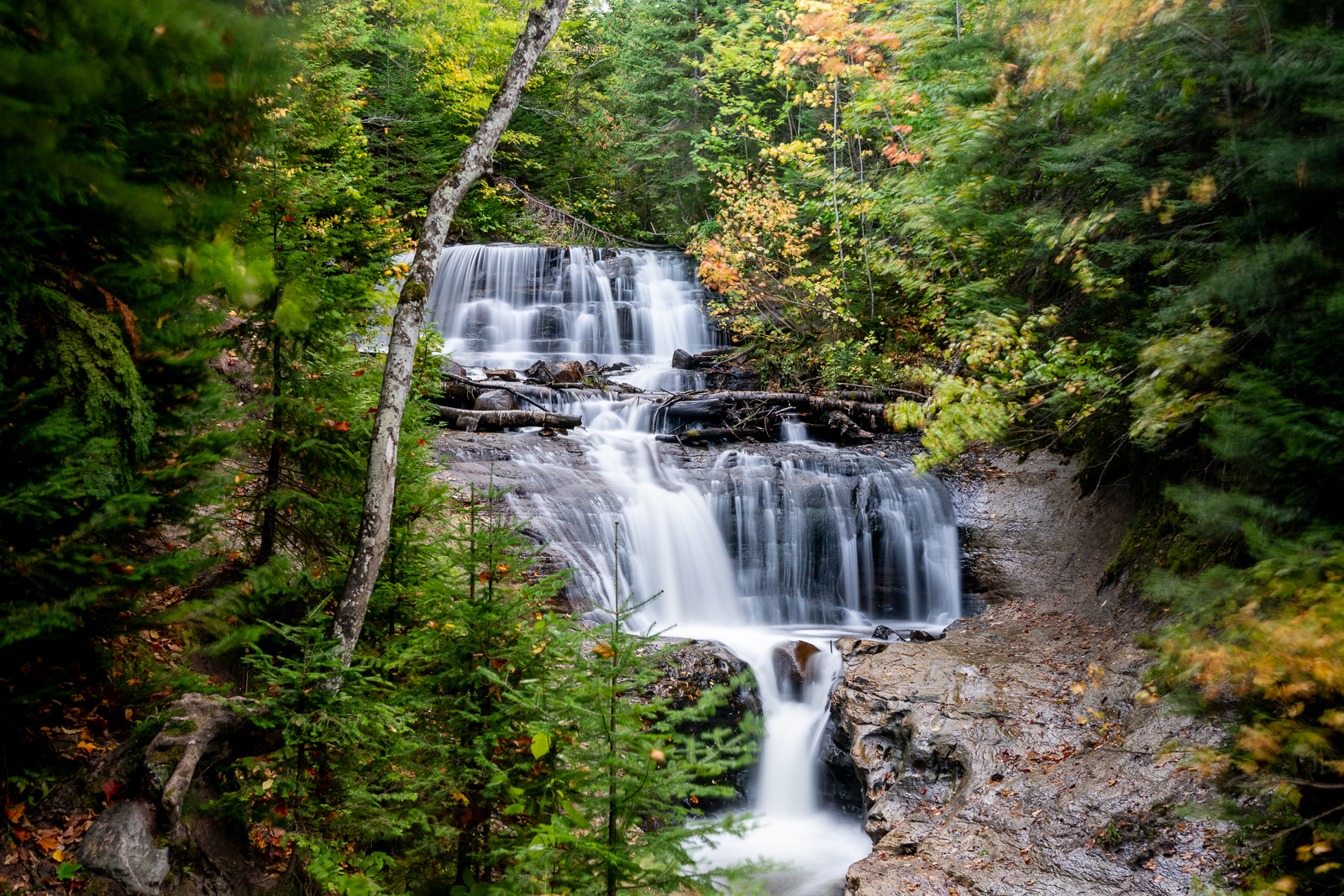 The smooth waters of a waterfall